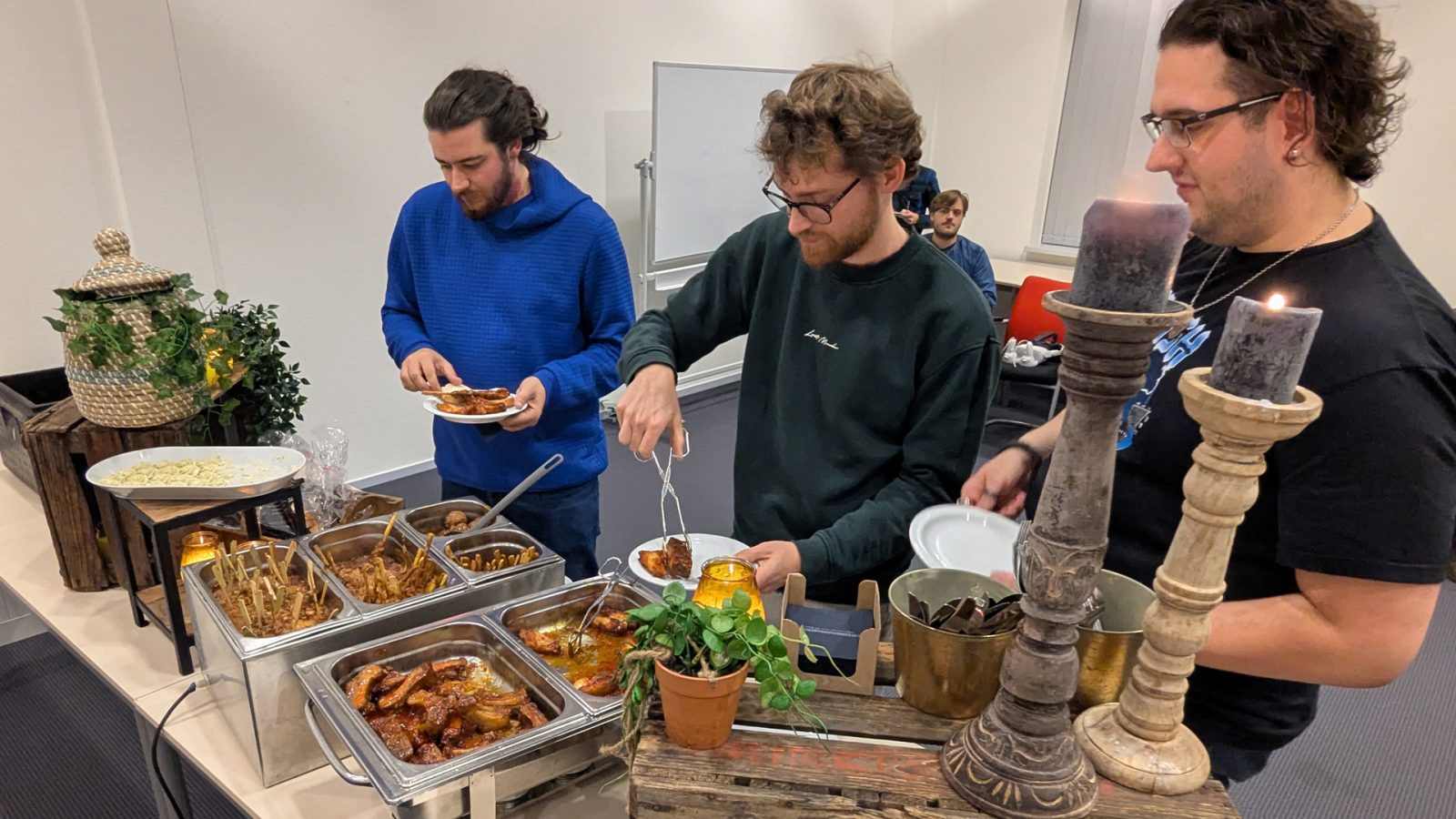 Balance between learning and relaxing: enjoying food together with the team after collaborating.
