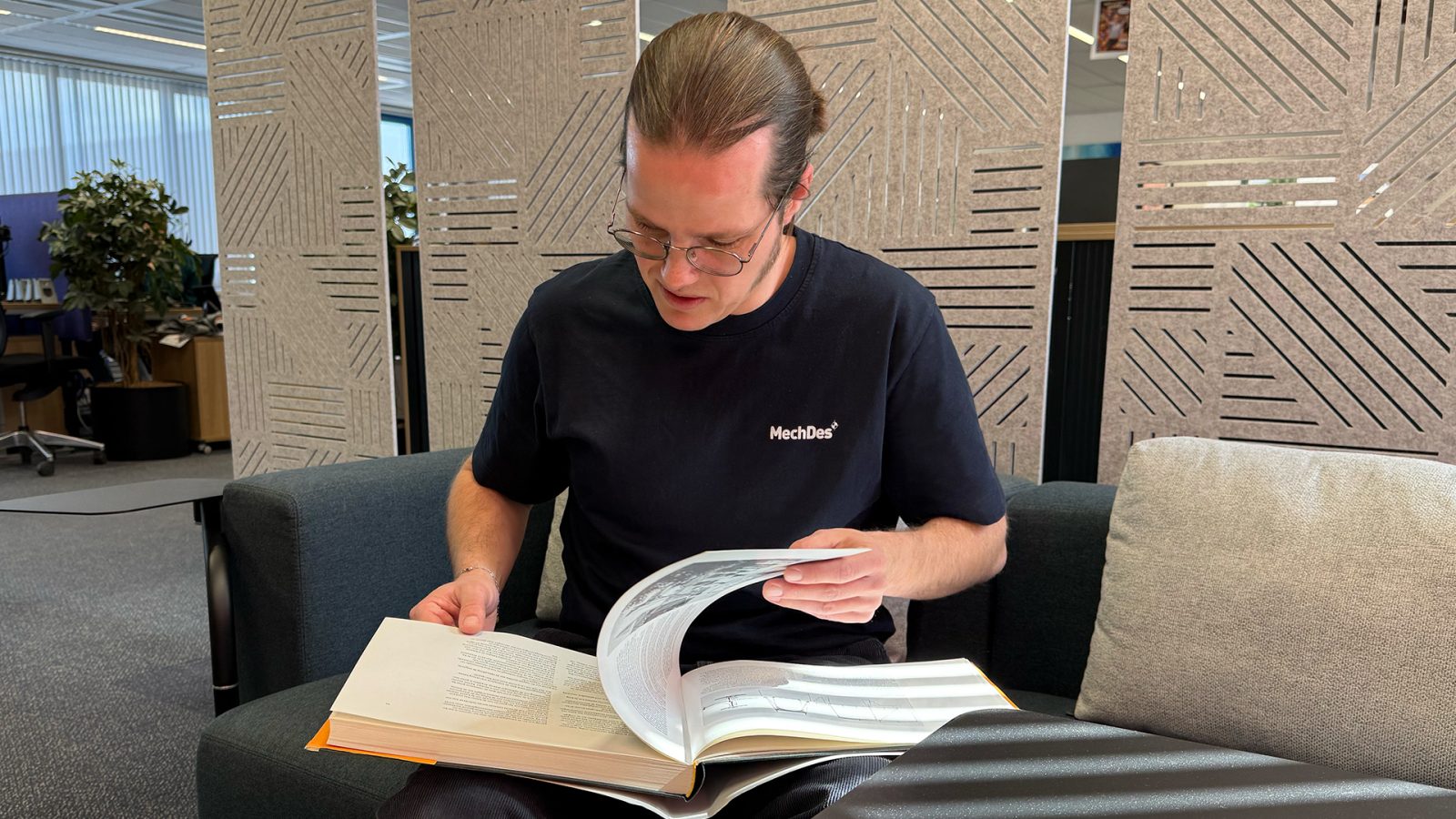 David browsing through a book about movable bridges from the early 1900s.