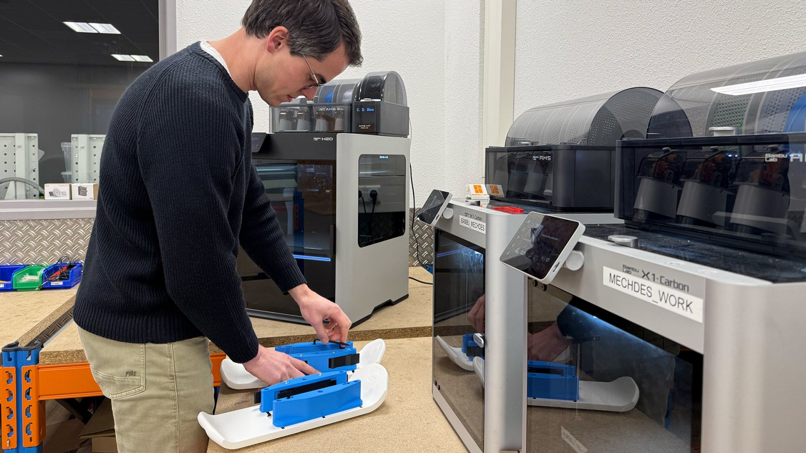 Mechanical Engineer Joost with his 3D-printed mini ski for under the stroller.