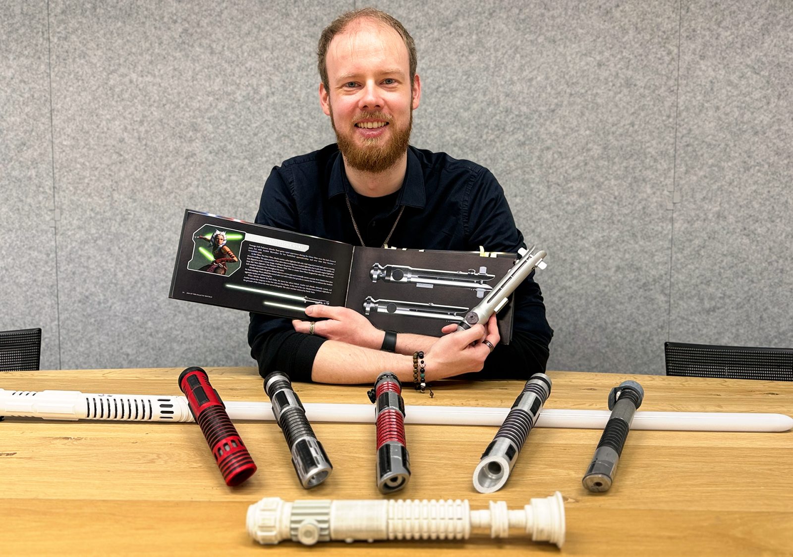 The book Star Wars: The Lightsaber Collection serves as a reference guide for true fans like Pascal, because every detail has to be accurate. In front of him are all the iterations of his self-designed lightsabers.