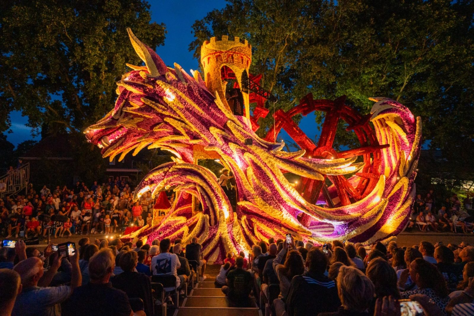 The flower parade float with tens of thousands of illuminated dahlias during the evening parade in Sint Jansklooster.